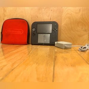 Nintendo 2DS with case, 5 games, and charger